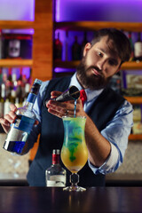 Bartender guy working prepare cocktail skills