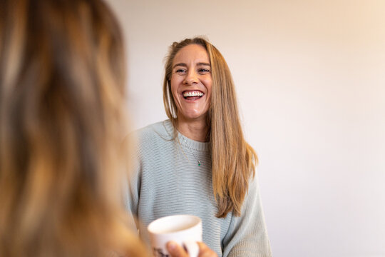 Close up shot of a smiling woman talking to her partner
