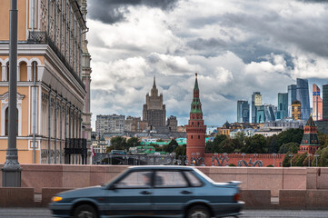 Fototapeta na wymiar The car moves along the bridge against the backdrop of views of Moscow. Blurred motion.