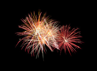Red pink fireworks on black background for celebration and anniversary .