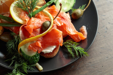Sandwich with salmon and greens.