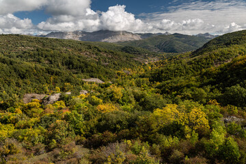 Obraz premium Valley, town of Orzonaga and mountains of the Hoces de Vegacervera from the Hayedo de Orzonaga, León, Spain.