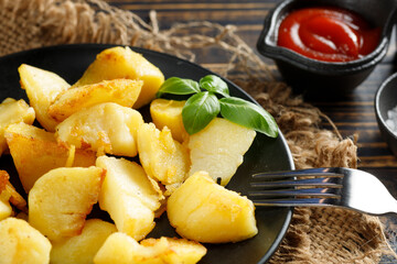 Fried potatoes close-up. Tasty and simple food. Traditional lunch.
