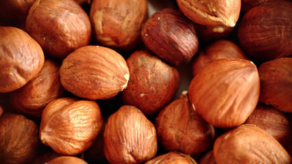 A handful of large hazelnuts close-up selective focus