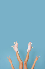 Fototapeta premium Roller skates on female legs.