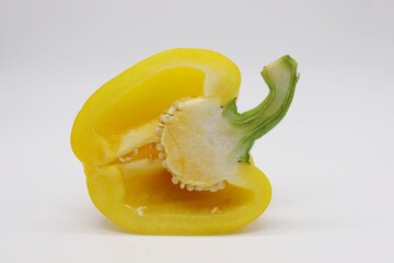 sliced yellow bell pepper on white background