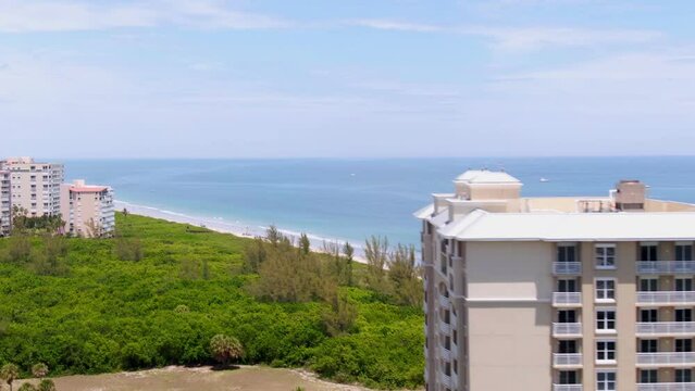 Orbiting drone shot of beautiful blue beach on Florida east coast
