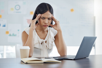 Headache, stress and burnout with a business woman at work on a laptop at a desk in her office. Computer, compliance and mental health with a female employee suffering from a migraine while working