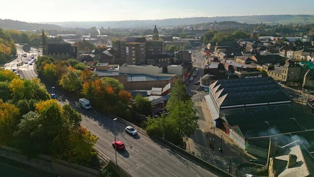 Aerial drone footage of the English market town centre of Dewsbury in West Yorkshire in the UK showing the historical town centre and townhall.
