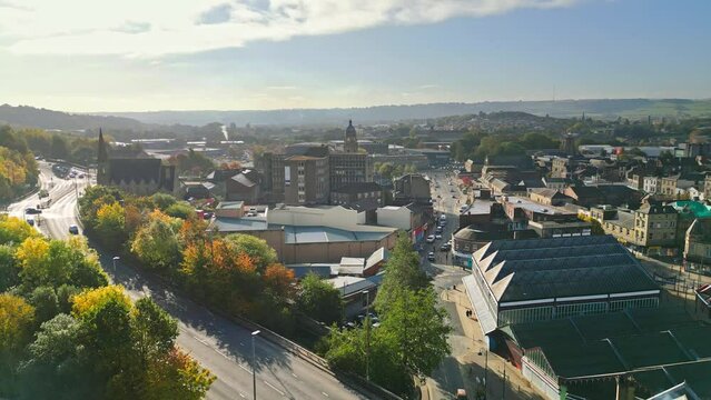 Aerial footage of the English market town centre of Dewsbury in West Yorkshire in the UK showing the historical town centre and townhall.