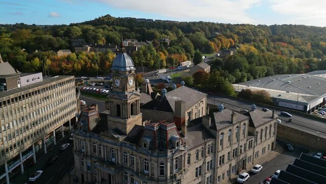 Aerial video footage of the market town centre of Dewsbury in West Yorkshire in the UK showing the historical town centre and townhall.