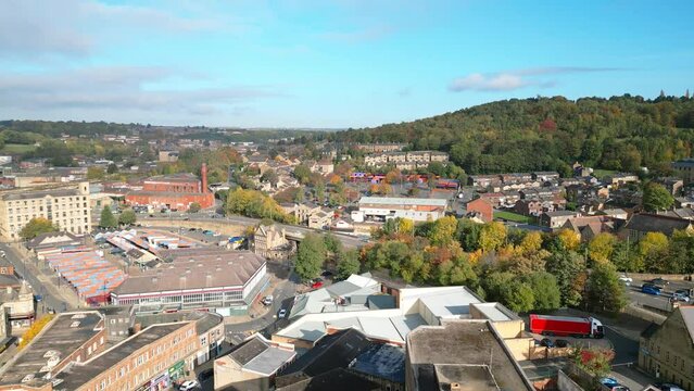 Aerial drone footage of the market town centre of Dewsbury in West Yorkshire in the UK showing the historical town centre and townhall.