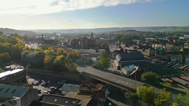 Aerial footage of the large market town centre of Dewsbury in West Yorkshire in the UK showing the historical town centre and townhall.