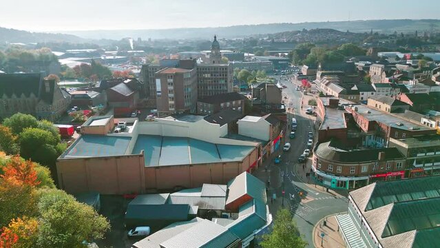 Aerial drone footage of the English market town centre of Dewsbury in West Yorkshire in the UK showing the historical town centre and the Dewsbury townhall.