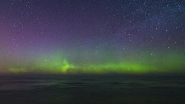 Time-lapse of the Northern Lights (aurora borealis) in the night sky above Lake Superior.  Shot near Marquette, Michigan