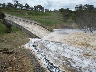 Lake Eppalock dam spillway overflowing into the Campaspe River near Bendigo after heavy spring rain...
