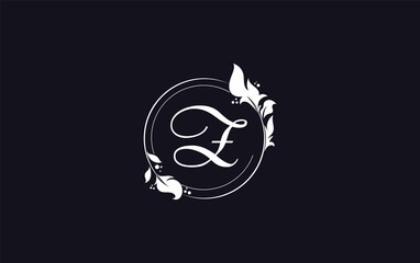 Golden circle leaf and beauty logo design with the letters and alphabets for brand and business