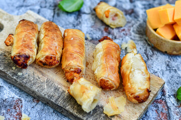  Greek style Mini filo pastry rolls with bacon and cheddar cheese .Home made bakery .Fresh baked  Mini cheese  ,meat and herbs puff pastries