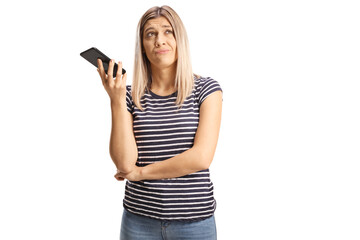 Bored young woman listening to phone conversation on speakerphone