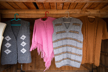Countryside Handmade knitted products made of natural wool on street market. Warm knitted things...