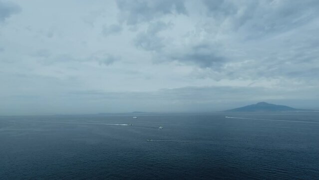 Ship and boat traffic in the Mediterranean sea with clouds