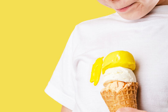 Kid Spilling Ice Cream. A Dirty Ice Cream Stain On A White T-shirt. Clothes Ruining. Isolated. Daily Life Stain Concept