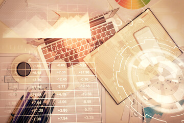 Multi exposure of forex chart drawing over table background with computer. Concept of financial research and analysis. Top view.