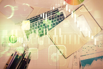 Multi exposure of forex chart drawing over table background with computer. Concept of financial research and analysis. Top view.