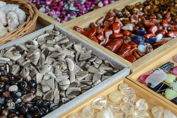 a lot of jewelry colorful stones on the counter for sale. gems.