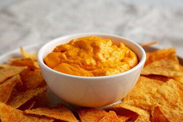Cheese dip with tortilla chips, low angle view. Close-up.