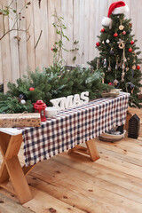 New Year and Christmas outdoor decorations. Christmas tree, wreath and gifts. Winter holidays and celebrations.