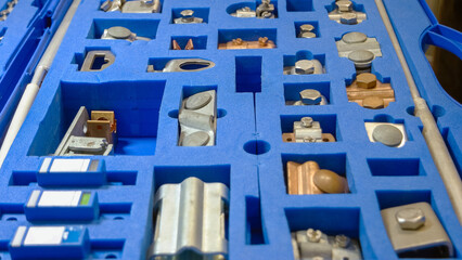 Set of metallic machine details in the blue foam rubber. Many various steel details.