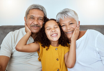 Love, grandparents and girl being happy, smile and bonding together, embrace or together on living room couch. Grandfather, grandmother and grandchild portrait, enjoy visit and happiness on home sofa