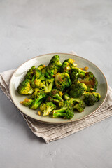 Homemade Pan-Fried Broccoli on a Plate, side view.