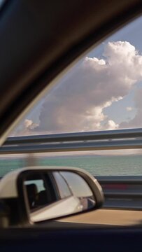 Vertical Video, View From Of The Side Mirror The Inside Of A Driving Car Along The Highway In A Sunny Day. Concept Of Vehicles And Transport. No People.