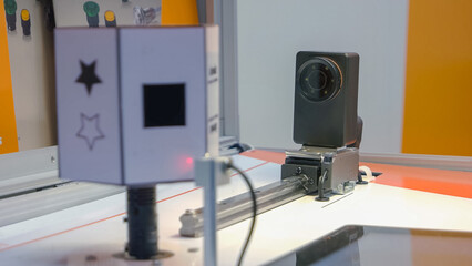 Close-up blinking autonics relay and rotating element. Manufacturing machine in action.