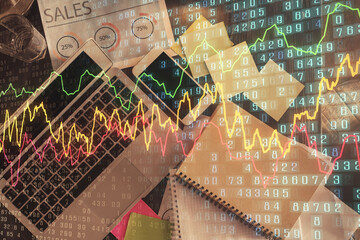 Financial market graph and top view computer on the desktop background. Multi exposure. Investment concept.