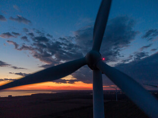 Wind turbine at sunset close-up