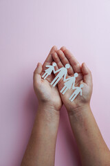 hands holding paper family cutout, life health insurance, social distancing concept, covid19,  on...