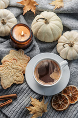 Fototapeta na wymiar White pumpkins, coffee and autumn leaves