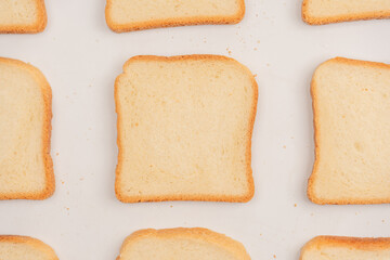 Delicious bread slices isolated on a white background, top view.