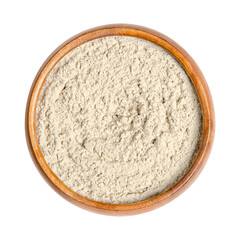 Bentonite, dry powder of montmorillonite in a wooden bowl. Used in folk medicine as medicinal clay, for internal and external use, it is an absorbent swelling clay, formed from weathered volcanic ash.