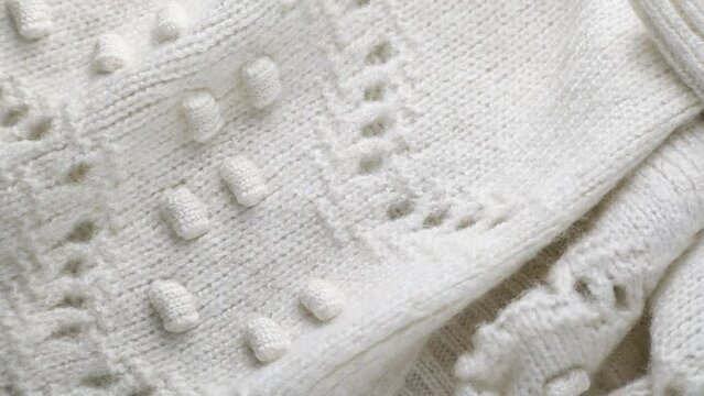 Fashionable knitted woolen cloth, warm soft textile close up view
