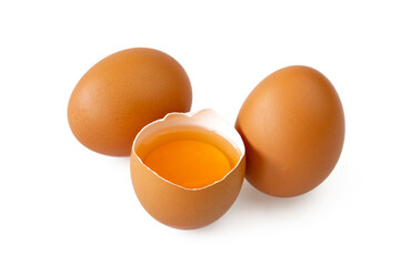 Two chicken eggs and one broken isolated on a white background.