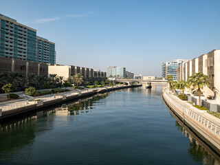 The canal and buildings in the Al Raha Beach neighbourhood in Abu Dhabi. Al Raha Beach is a mixed-use development with waterfront apartments.