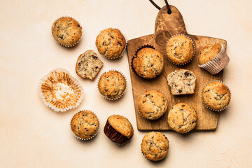 Chocolate banana muffins on a wooden board, top view - 541176193