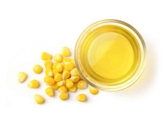 Top view of corn oil in glass bowl with seed isolated on white background.