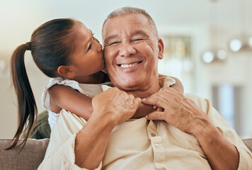 Happy, grandfather and little girl kiss with hug for love and care in family bonding time or...