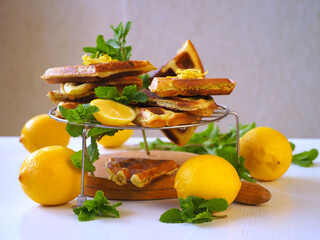 Naklejka na ściany i meble Belgian waffles with lemon and mint