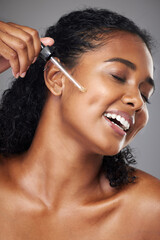 Black woman, face moisturizer and oil serum, beauty and skincare, natural cosmetics ad in studio...